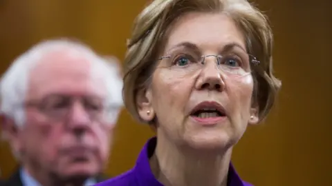 Getty Images Elizabeth Warren and Bernie Sanders appear together at a news conference.