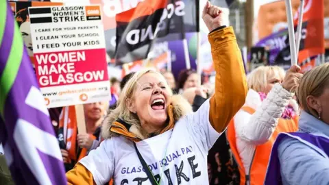 Getty Images Thousands of women marched in Glasgow in one of the UK's biggest equal pay strikes.