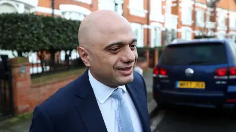 Reuters Former Chancellor of the Exchequer Sajid Javid leaves his home in London