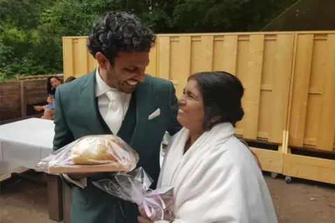 Handout Sanul with the birth mother at his wedding