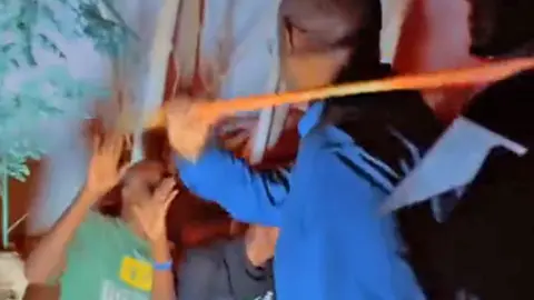 @MohamedSelh Yusuf Hussein Jimale "Madale" whipping young people with a stick in Mogadishu, Somalia - April 2023
