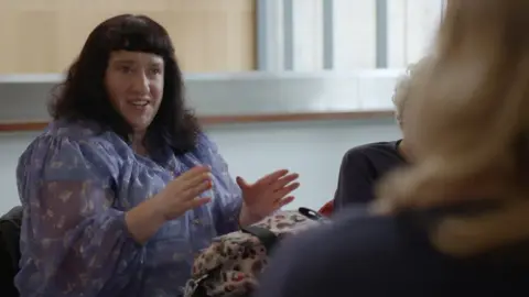 Bristol Women's Voice Jemma talking to women in the organisation Disabled Women Take Action