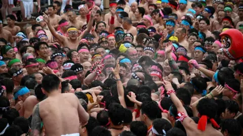 Reuters Participants take part in a ritual event of naked festival at Owari Okunitama Shrine