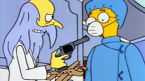 Fox The Simpsons poked fun at Hughes’ legend as a reclusive madman when fellow billionaire Mr Burns proposed the aircraft “The Spruce Moose” and refused to cut his hair (Credit: Fox)
