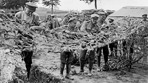 Lt J W Brooke/ Imperial War Museums via Getty Images Soldiers making camouflage netting in Basseux, 16 June 1918 (Credit: Lt J W Brooke/ Imperial War Museums via Getty Images)