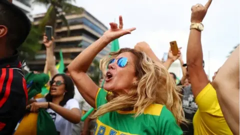 Reuters Supporters of Jair Bolsonaro cheer in Rio
