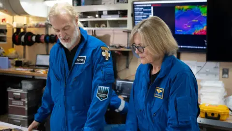 Enrique Alvarez Kathy and Victor look at plans