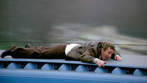 Alamy The Métro train sequence, in which Belmondo runs along the top of it while jumping down to avoid tunnels, is the most hair-raising of all (Credit: Alamy)