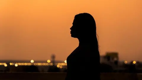 Getty Images Representative image: Silhouette of a woman during sunset or sunrise