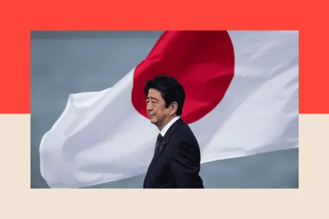 Getty Images Japanese Prime Minister Shinzo Abe at Joint Base Pearl Harbor, Hickam's Kilo Pier, on 27 December 2016 in Honolulu, Hawaii.