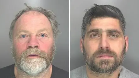 Cambridgeshire Police A composite image of two headshots of men with beards, both facing the camera against plain backgrounds. The man on the left, Smith, has light-colored hair, while the man on the right, Thomas, has darker hair.
